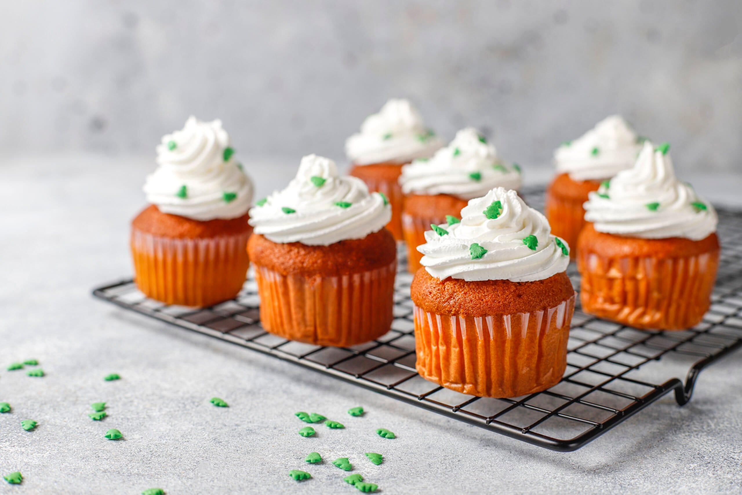 Flavoury cakesHappy New Year cupcakes with golden candles.